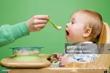 adult-feeding-baby.webp